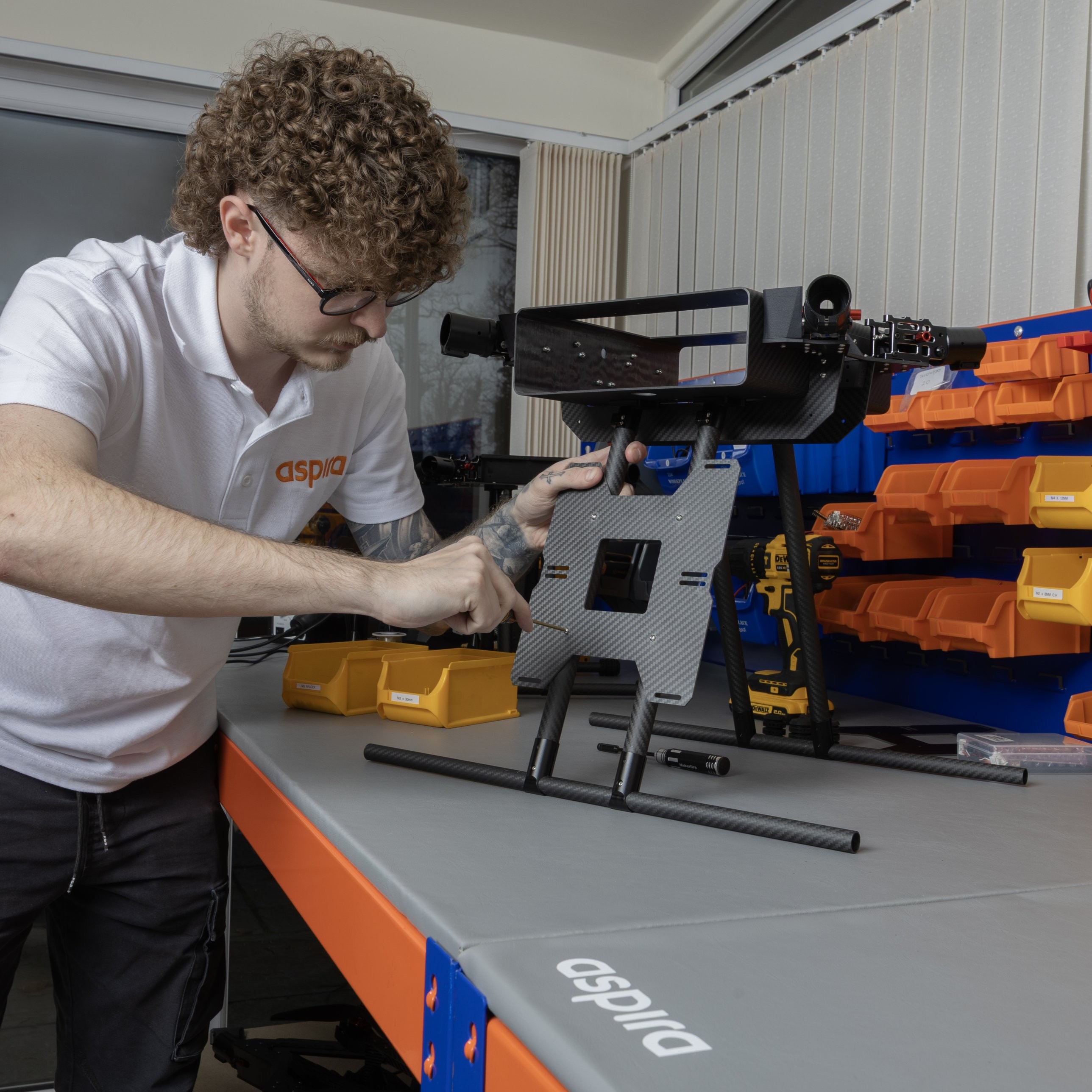 Aspira technician building an AC 4 in the workshop